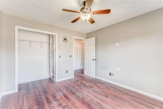 a kitchen with granite countertop cabinets stainless steel appliances and a window