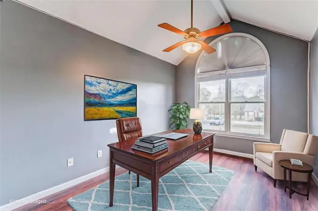 a kitchen with stainless steel appliances granite countertop a stove top oven a sink a refrigerator and white cabinets