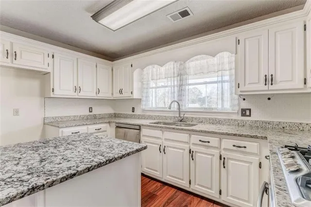a view of a backyard with a large tree