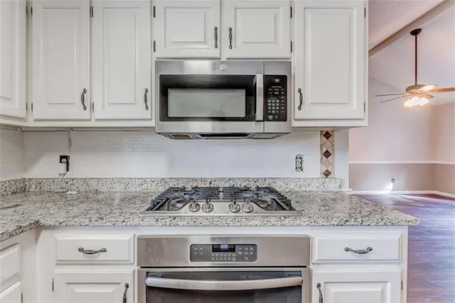 a view of an empty room with a large window