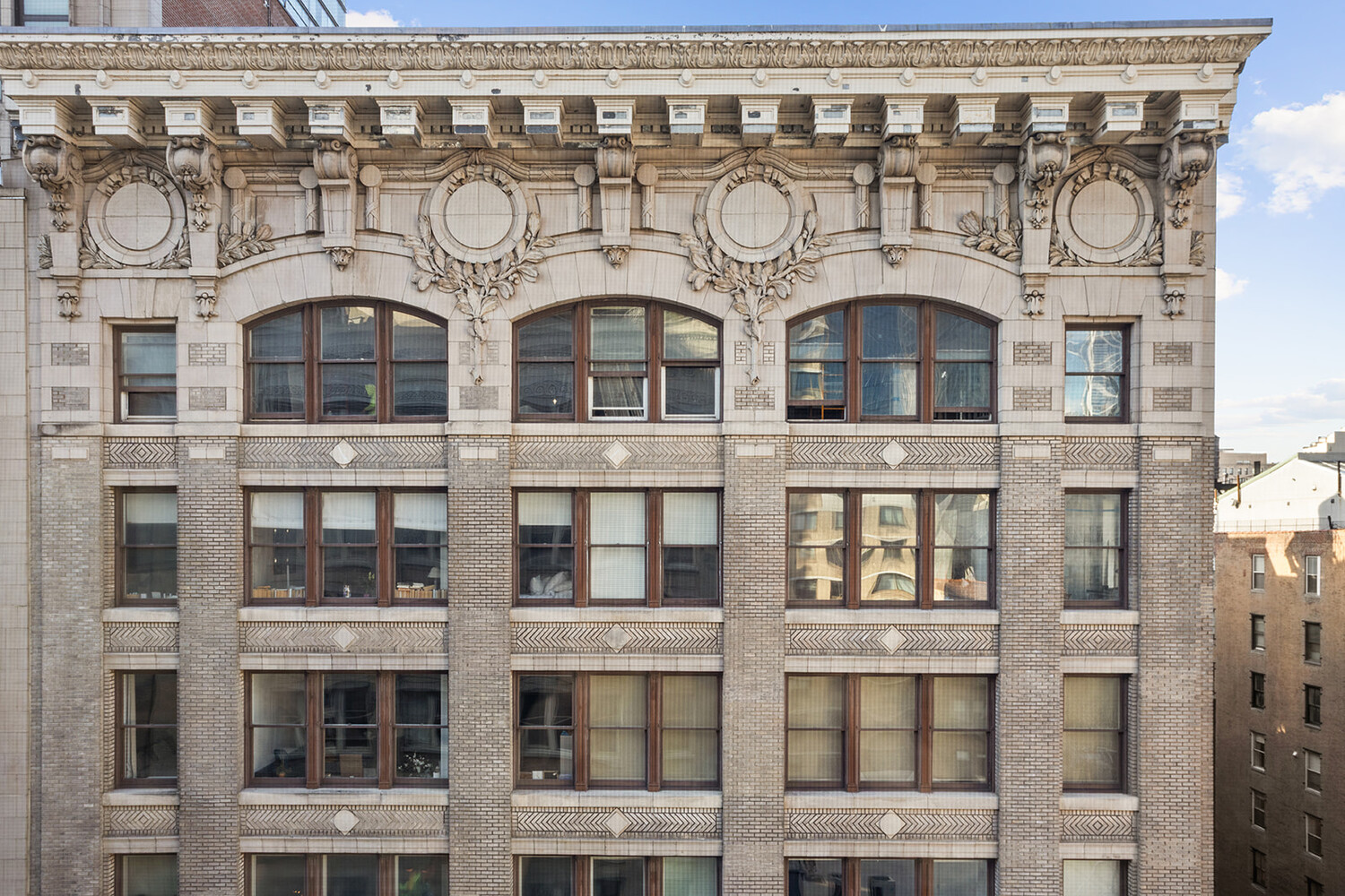49 East 21st Street, Unit 11B Manhattan, NY 10010 - Photo 11 of 12 a front view of a building with glass windows
