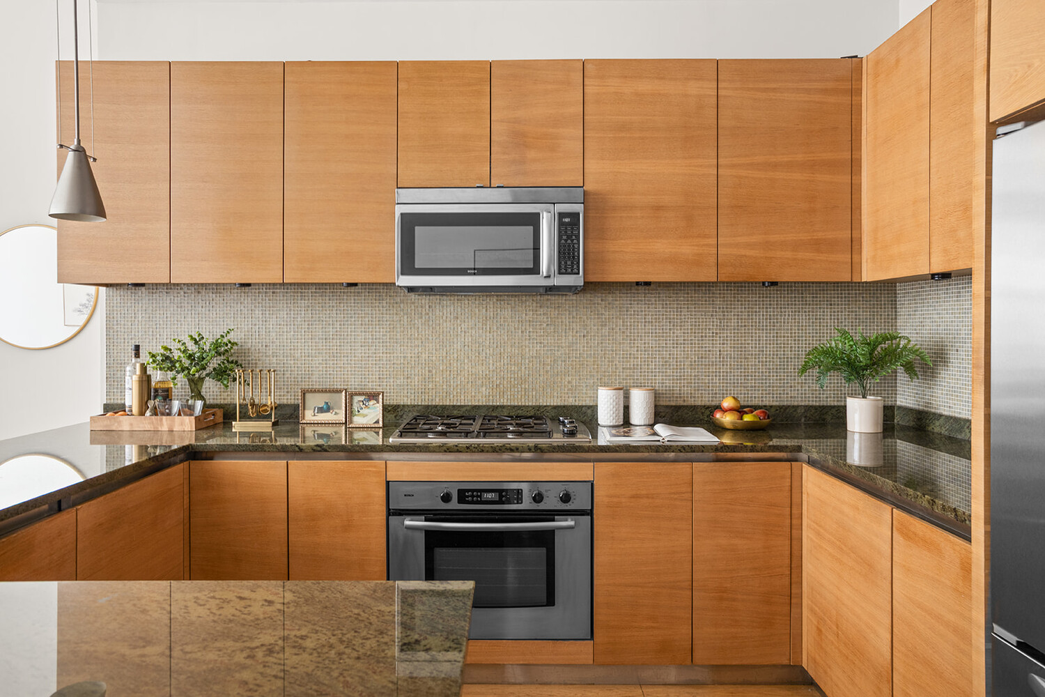 49 East 21st Street, Unit 11B Manhattan, NY 10010 - Photo 5 of 12 a kitchen with stainless steel appliances granite countertop a stove a sink and a white cabinets