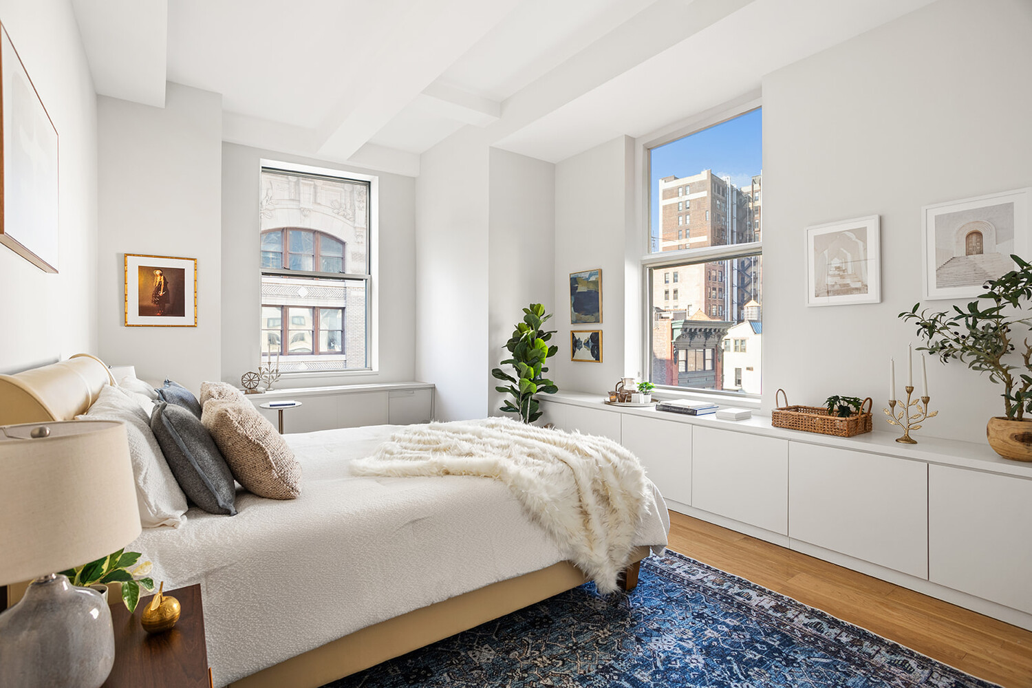 49 East 21st Street, Unit 11B Manhattan, NY 10010 - Photo 6 of 12 a bedroom with a bed and windows