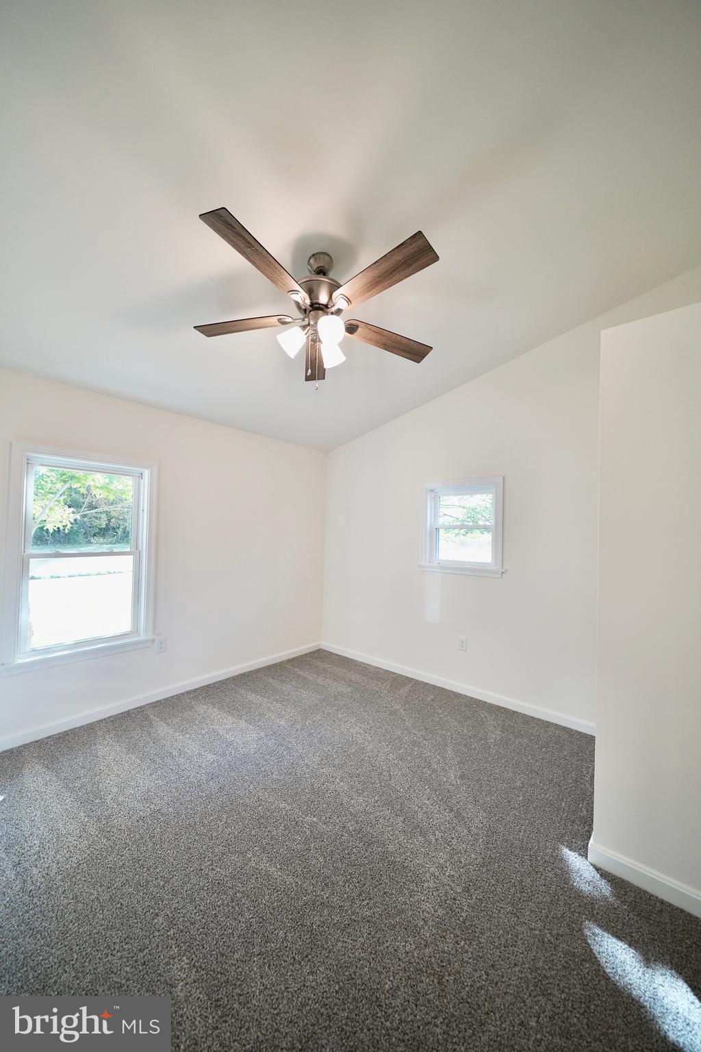 1465 Millington Road Clayton, DE 19938 - Photo 18 of 31 an empty room with a window and a fan