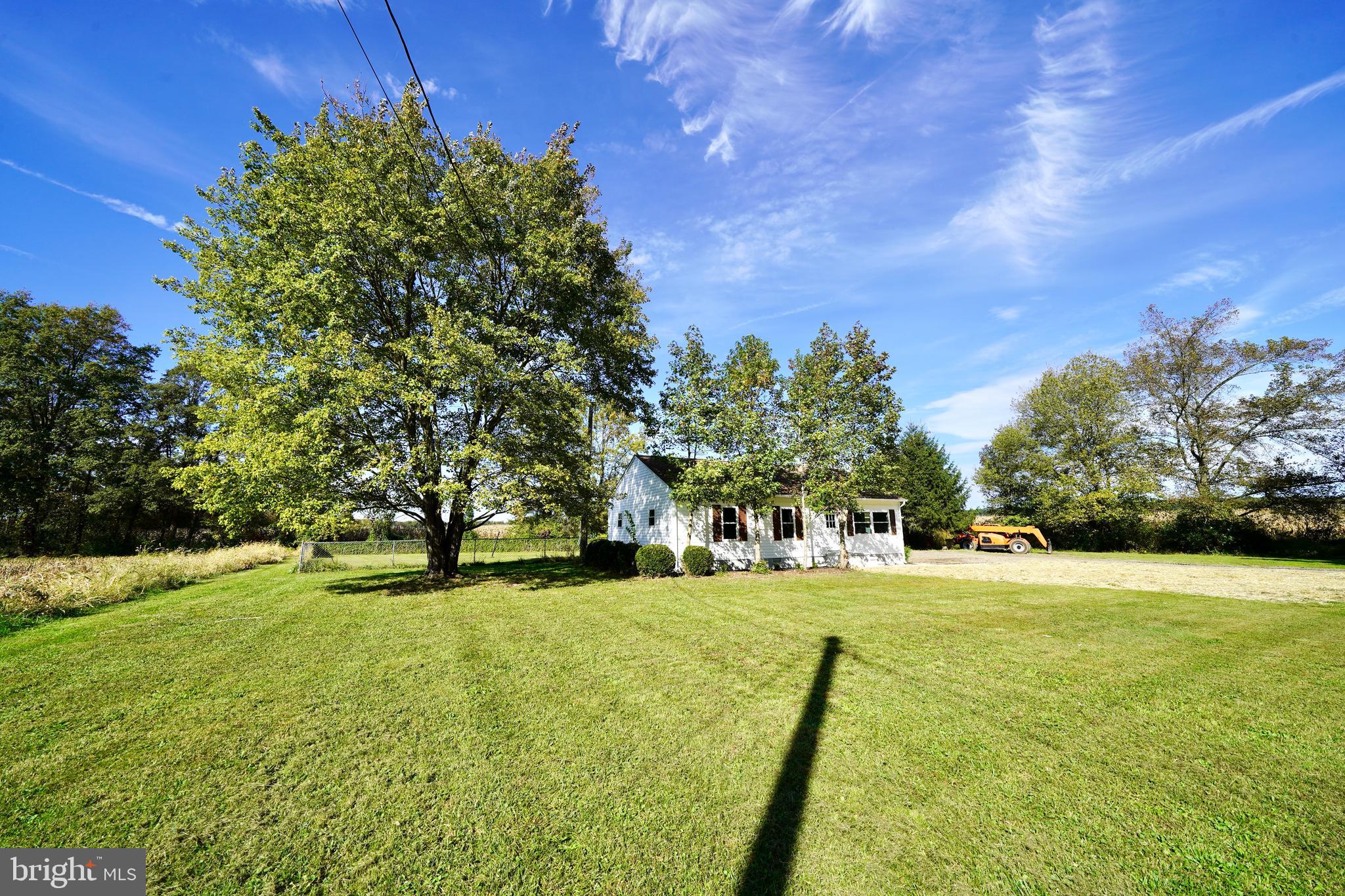1465 Millington Road Clayton, DE 19938 - Photo 3 of 31 a view of yard with swimming pool and trees