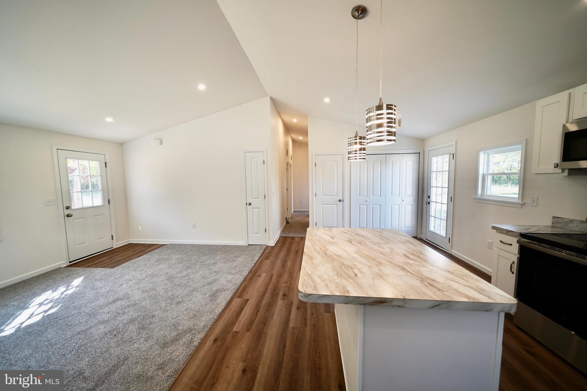 1465 Millington Road Clayton, DE 19938 - Photo 7 of 31 a very nice looking room with a kitchen island