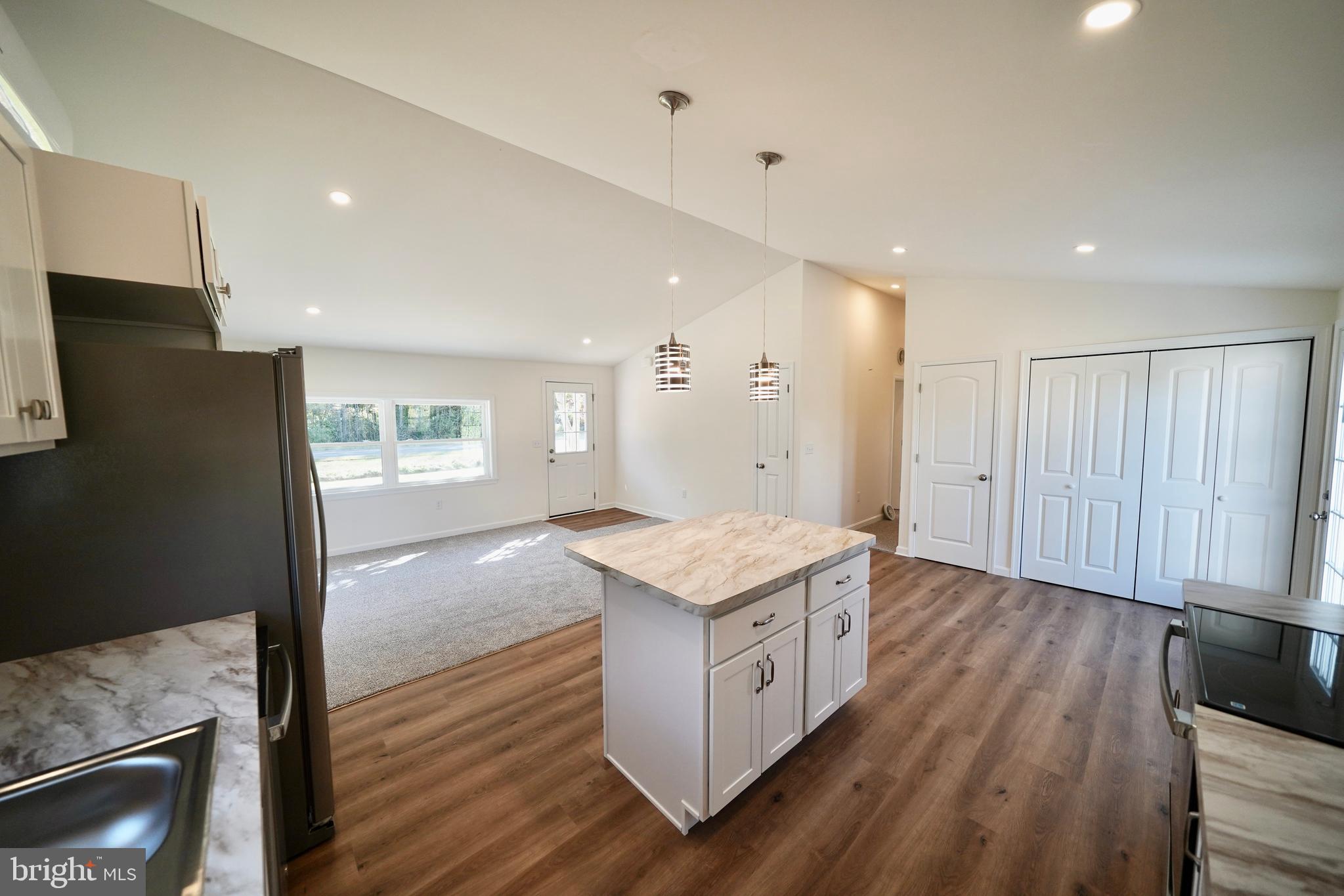 1465 Millington Road Clayton, DE 19938 - Photo 8 of 31 a kitchen with a sink stove and refrigerator