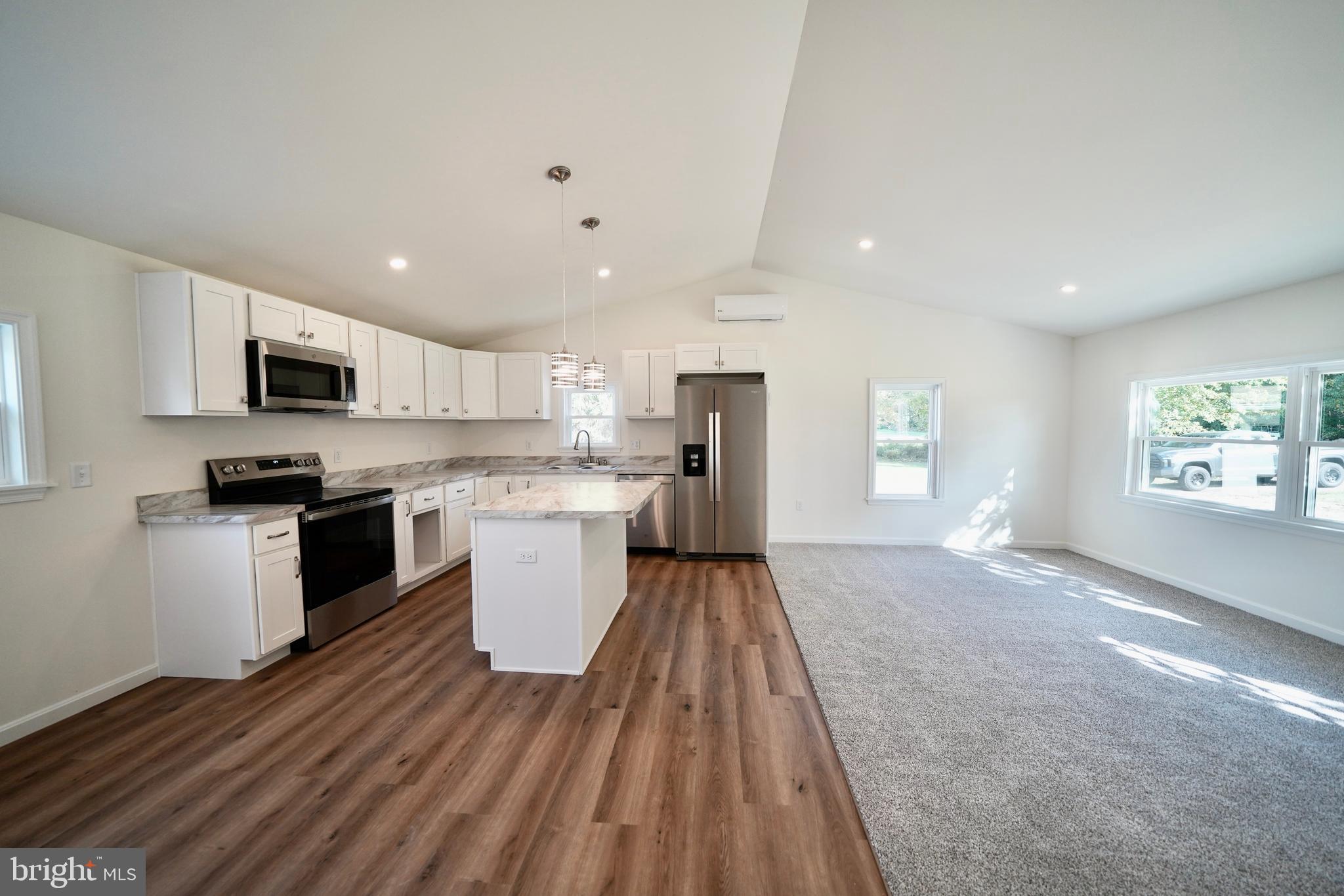 1465 Millington Road Clayton, DE 19938 - Photo 10 of 31 a large kitchen with a lot of counter space space stainless steel appliances and a window