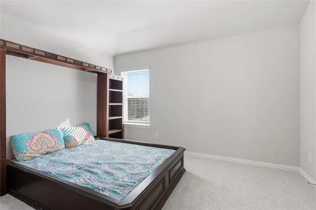 a view of wooden floor and cabinet in a room