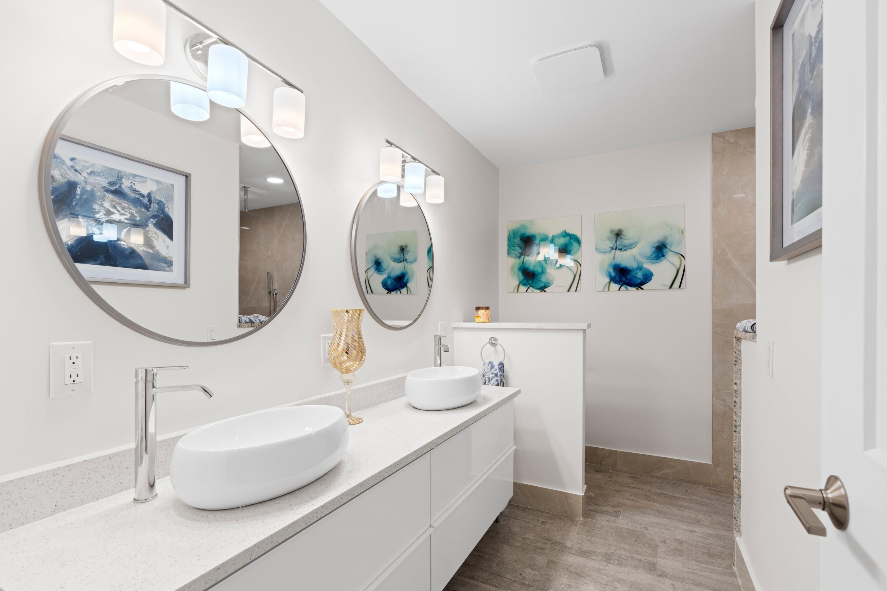 6850 Northwest 2nd Avenue, Unit 1 Boca Raton, FL 33487 - Photo 12 of 31 a bathroom with a double vanity sink and a mirror