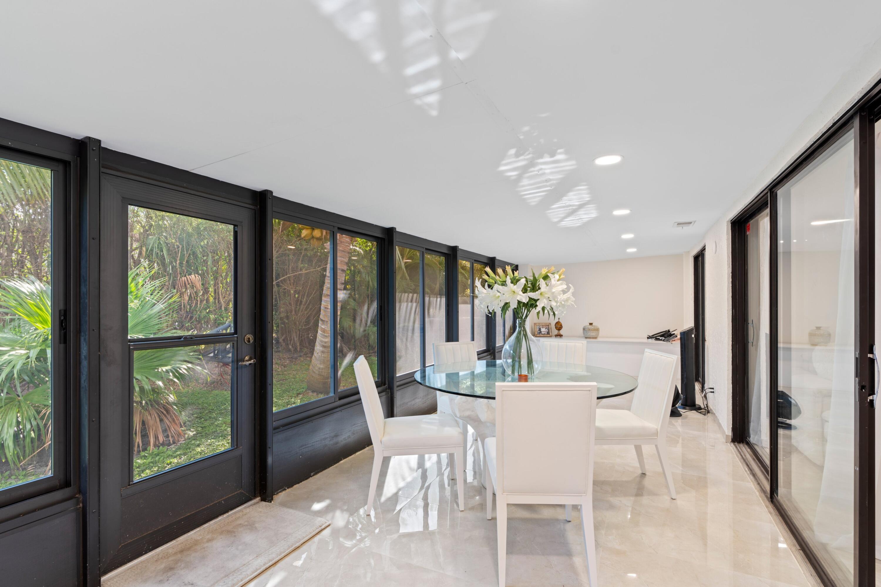 6850 Northwest 2nd Avenue, Unit 1 Boca Raton, FL 33487 - Photo 17 of 31 a view of a dining room with furniture window and outside view