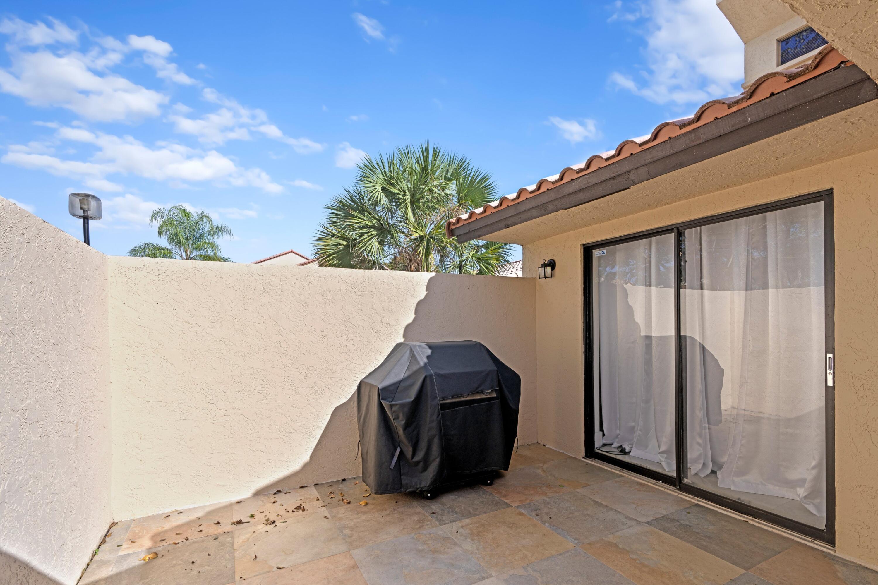 6850 Northwest 2nd Avenue, Unit 1 Boca Raton, FL 33487 - Photo 20 of 31 a house view with a backyard