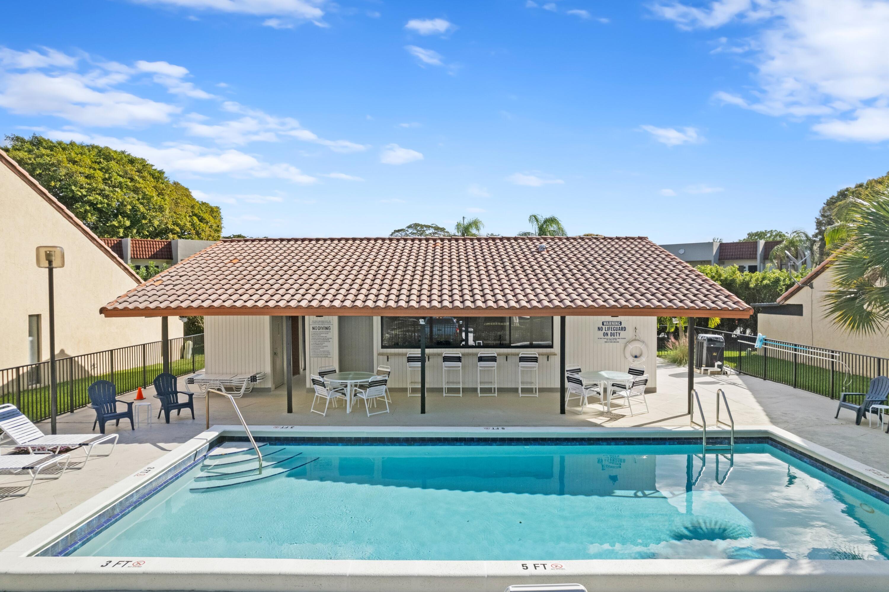 6850 Northwest 2nd Avenue, Unit 1 Boca Raton, FL 33487 - Photo 2 of 31 a view of a house with a patio