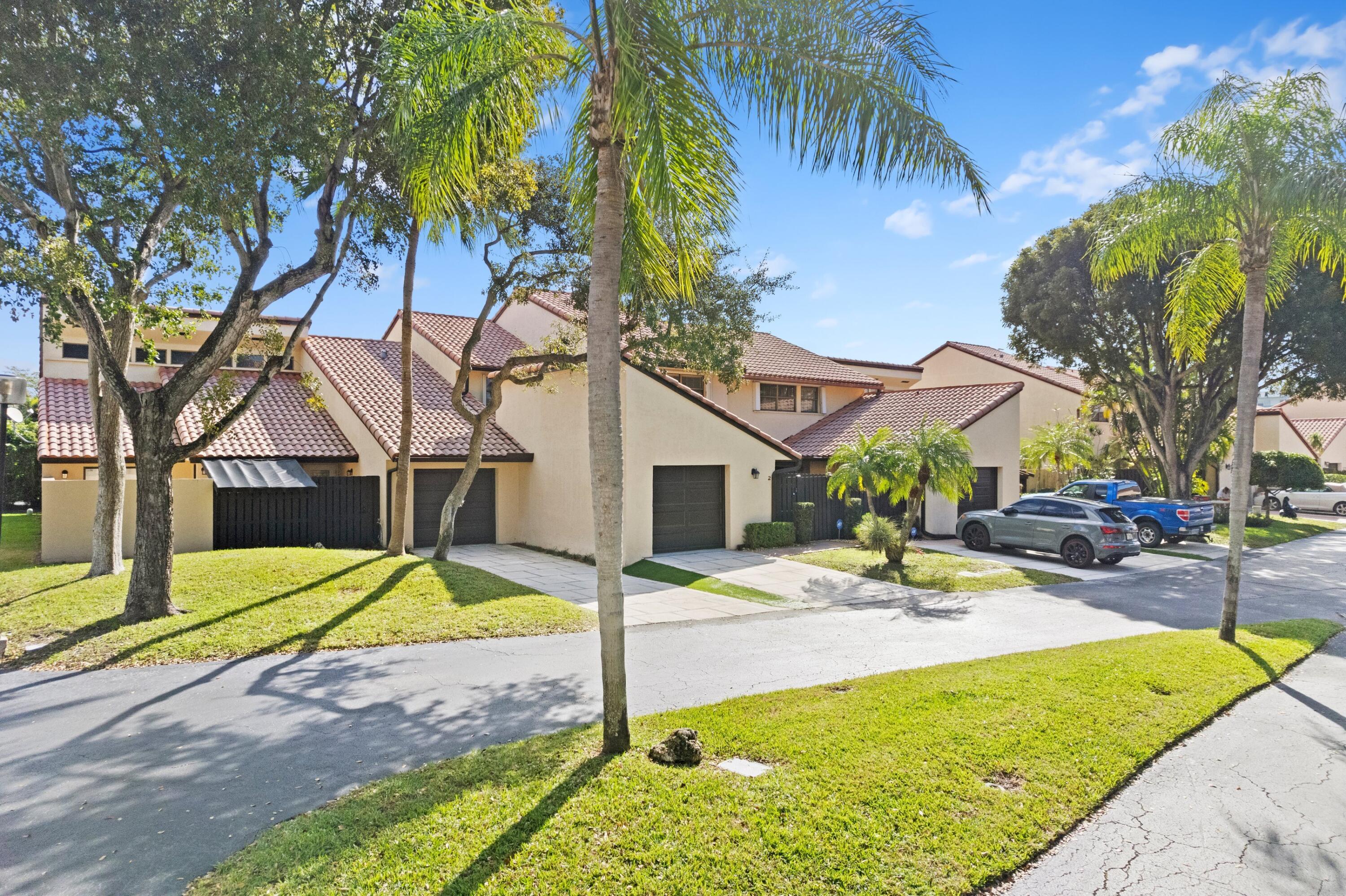 6850 Northwest 2nd Avenue, Unit 1 Boca Raton, FL 33487 - Photo 26 of 31 a view of a house with backyard and swimming pool