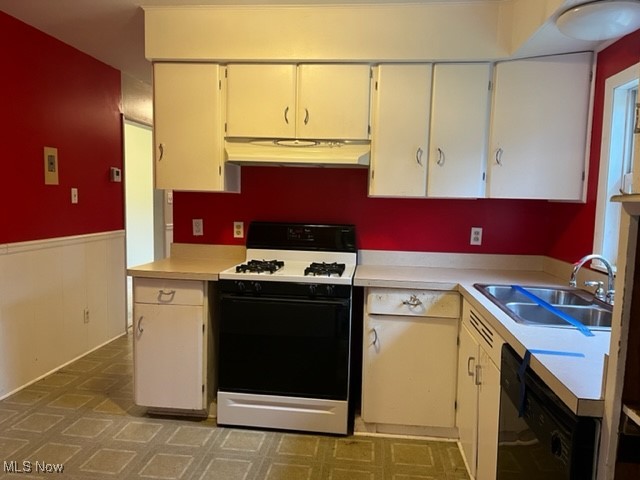 11423 Colburn Road Painesville, OH 44077 - Photo 8 of 16 Kitchen featuring white gas range oven, sink, and black dishwasher