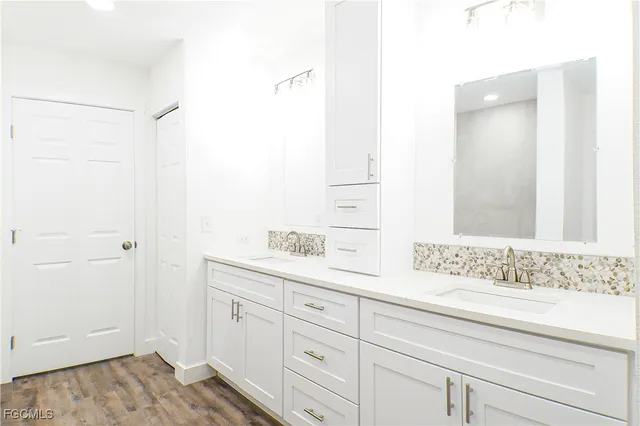 a bathroom with a sink and a mirror