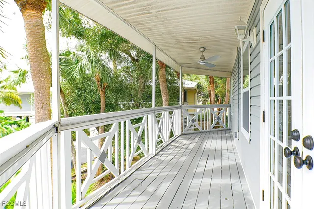 a view of a balcony with wooden floor