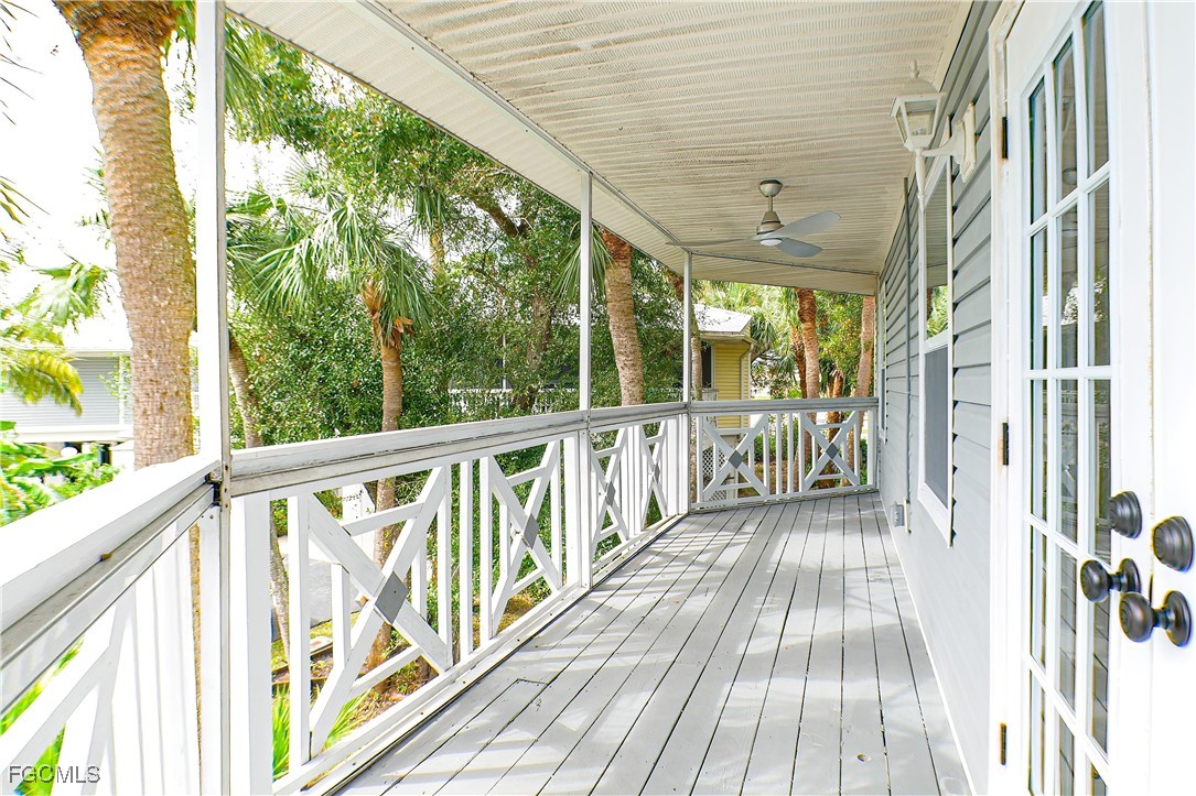 950 Moody Road, Unit 108 North Fort Myers, FL 33903 - Photo 18 of 21 a view of a balcony with wooden floor