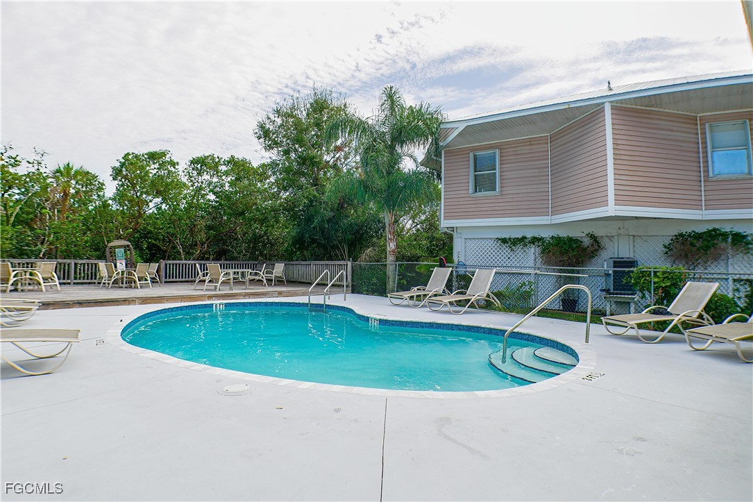 950 Moody Road, Unit 108 North Fort Myers, FL 33903 - Photo 20 of 21 a view of a swimming pool with back yard