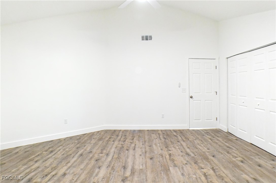 950 Moody Road, Unit 108 North Fort Myers, FL 33903 - Photo 8 of 21 an empty room with wooden floor