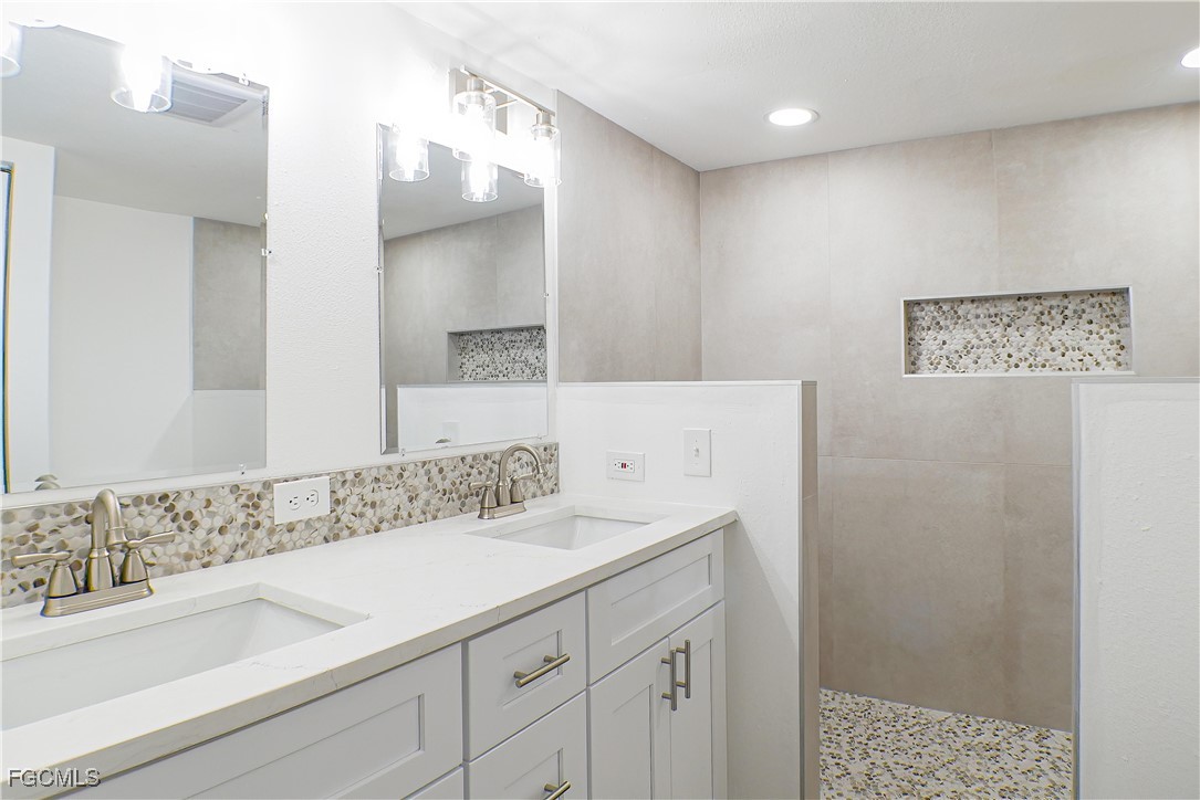 950 Moody Road, Unit 108 North Fort Myers, FL 33903 - Photo 9 of 21 a bathroom with a sink and a mirror