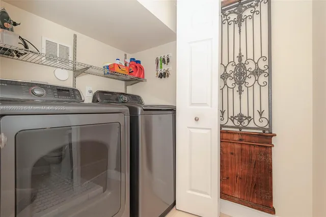 a kitchen with a refrigerator and cabinets