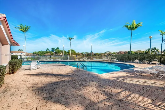 a view of a swimming pool with a lounge chairs