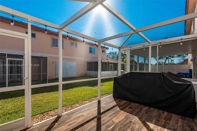 a view of a chair and table in the balcony