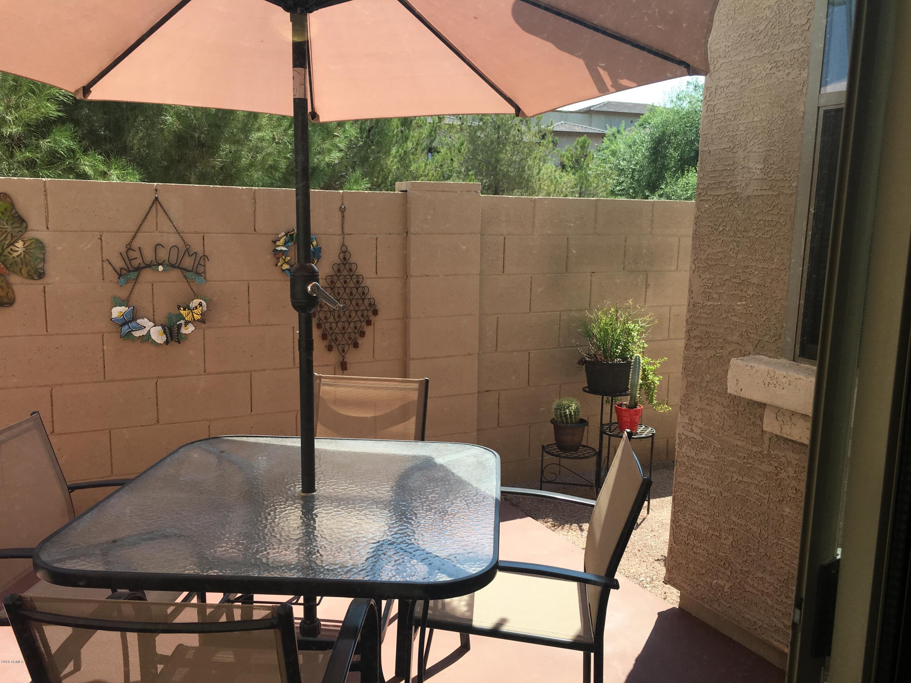 1987 East Del Rio Street Gilbert, AZ 85295 - Photo 25 of 28 a backyard of a house with table and chairs