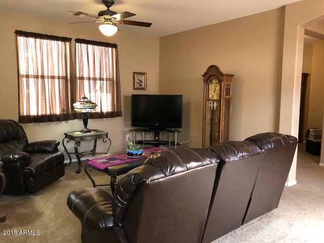 1987 East Del Rio Street Gilbert, AZ 85295 - Photo 8 of 28 a living room with furniture and a flat screen tv