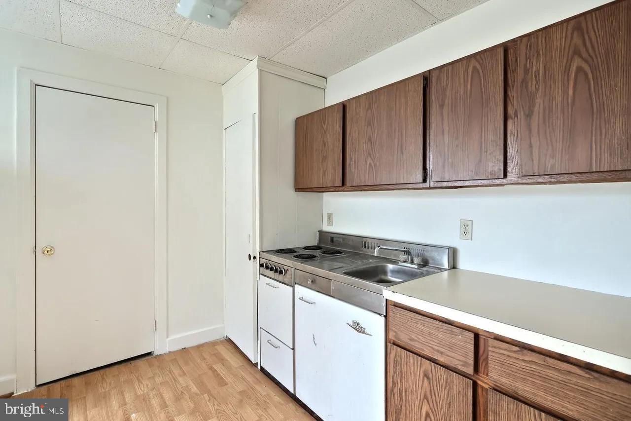 504 Baltimore Street, Unit 3 Gettysburg, PA 17325 - Photo 5 of 5 a kitchen with granite countertop cabinets and sink