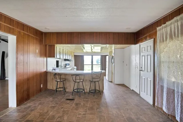 a kitchen with a stove a sink and a refrigerator
