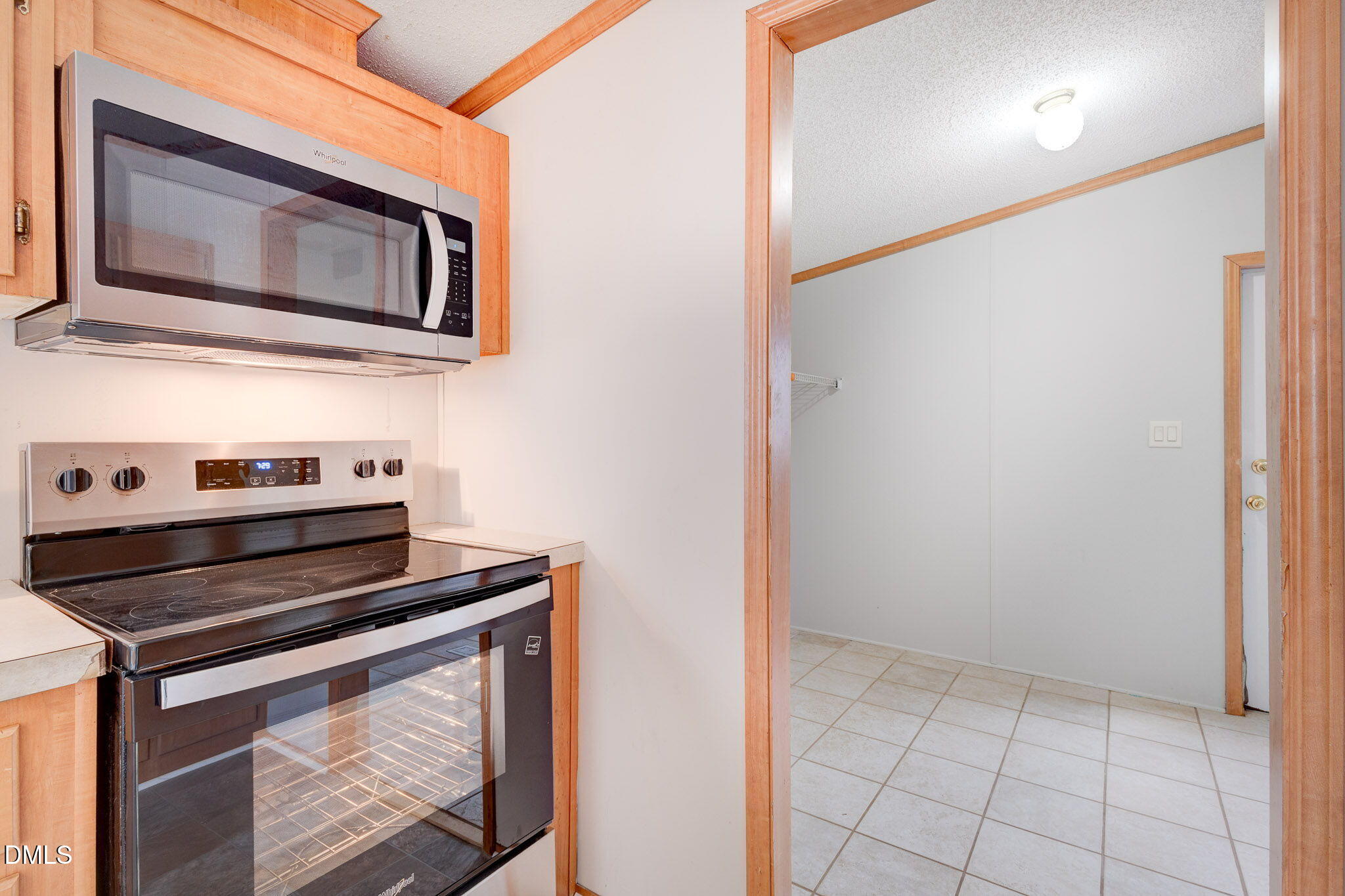 10037 Smith Road Middlesex, NC 27557 - Photo 8 of 36 a kitchen with a stove and a microwave