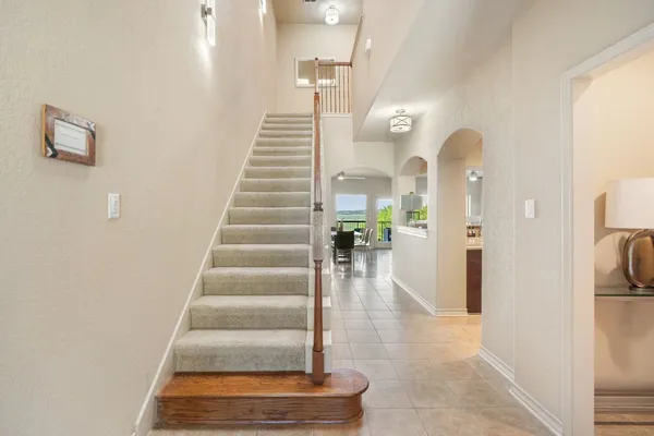 a kitchen with stainless steel appliances granite countertop a stove refrigerator sink and cabinets