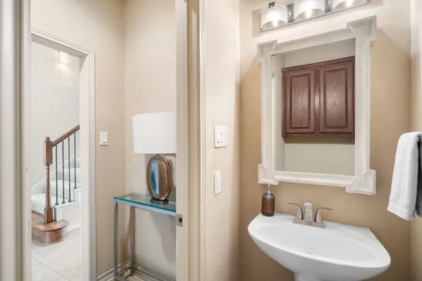 a large kitchen with stainless steel appliances granite countertop a sink and dishwasher a stove with wooden floor