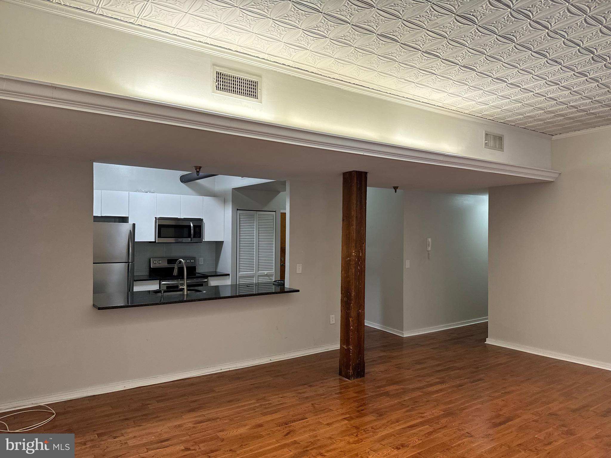 222 Church Street, Unit 5B Philadelphia, PA 19106 - Photo 6 of 15 a view of kitchen and living room