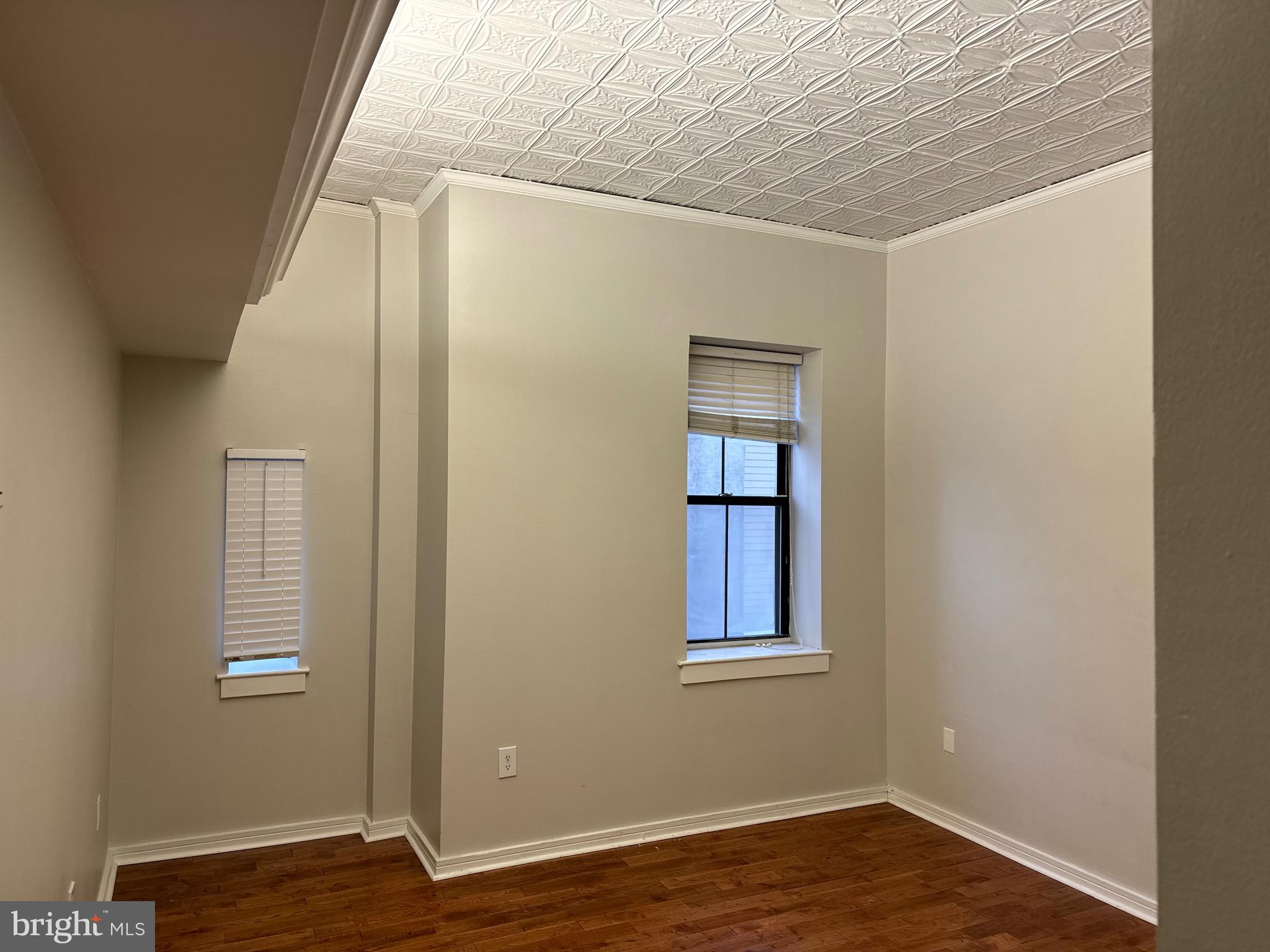 222 Church Street, Unit 5B Philadelphia, PA 19106 - Photo 8 of 15 a view of a livingroom with wooden floor and a window