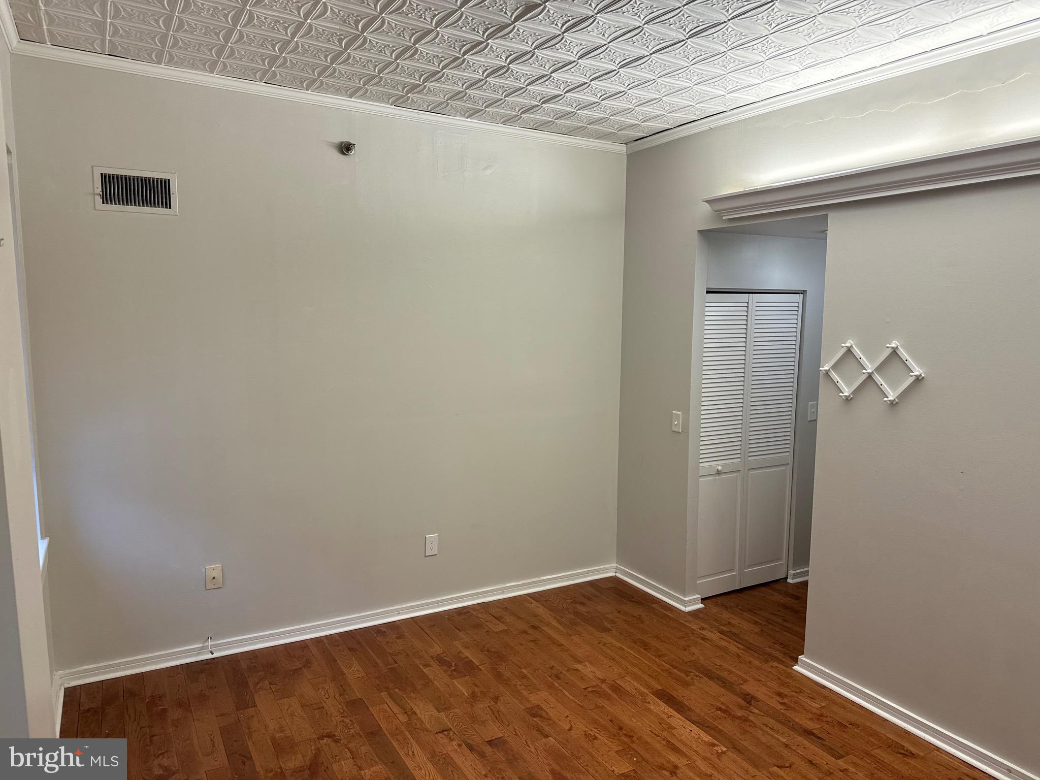 222 Church Street, Unit 5B Philadelphia, PA 19106 - Photo 9 of 15 an empty room with wooden floor and closet