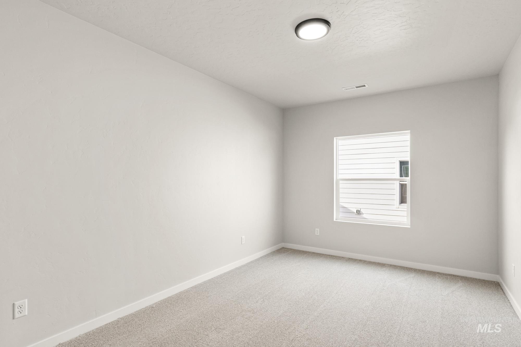 12865 Decatur Street Nampa, ID 83651 - Photo 20 of 20 Neutral-toned interior with light gray walls and plush gray carpeting