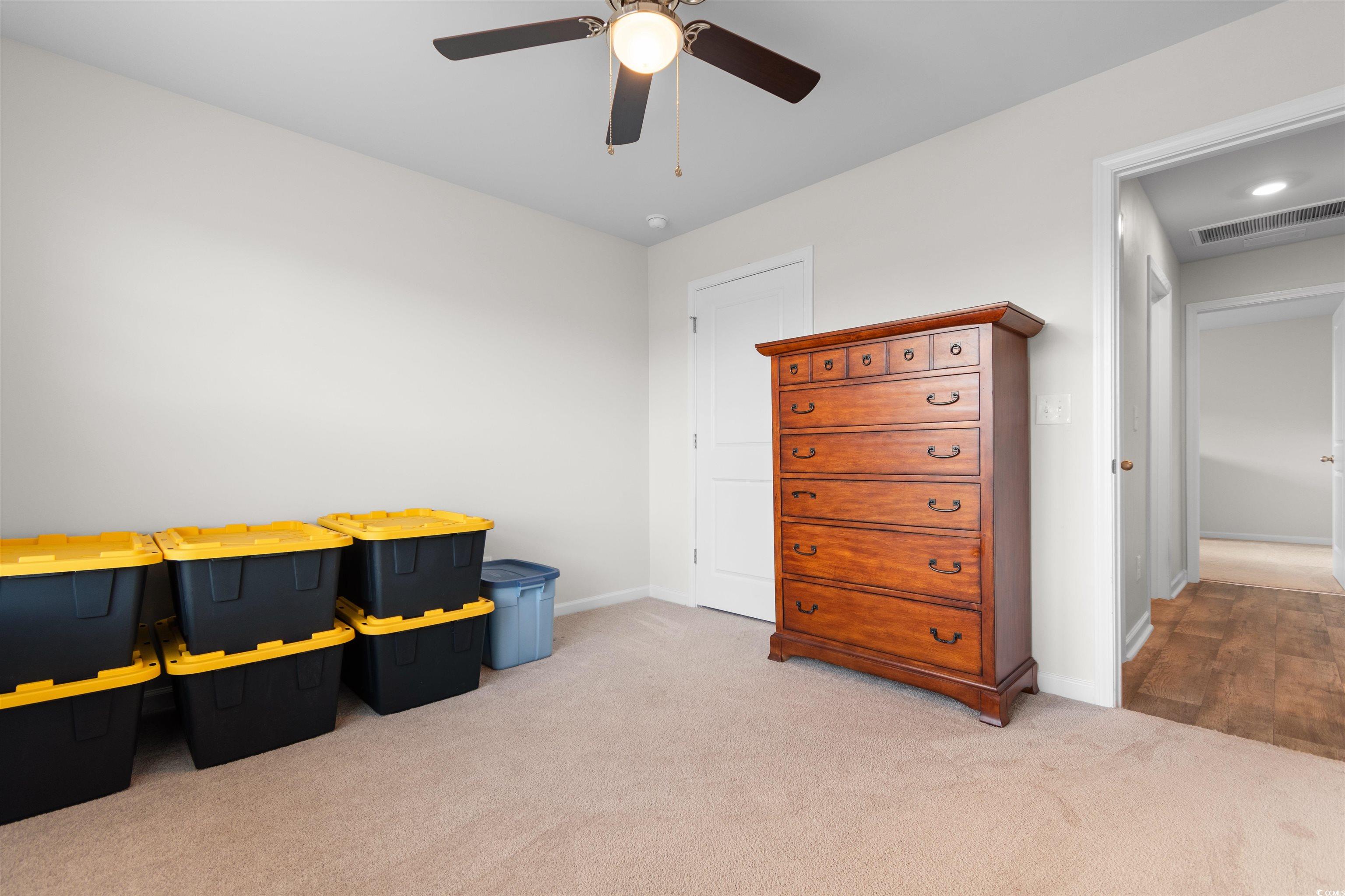 824 Twickenham Loop Longs, SC 29568 - Photo 15 of 27 Bedroom with carpet floors, baseboards, ceiling fa