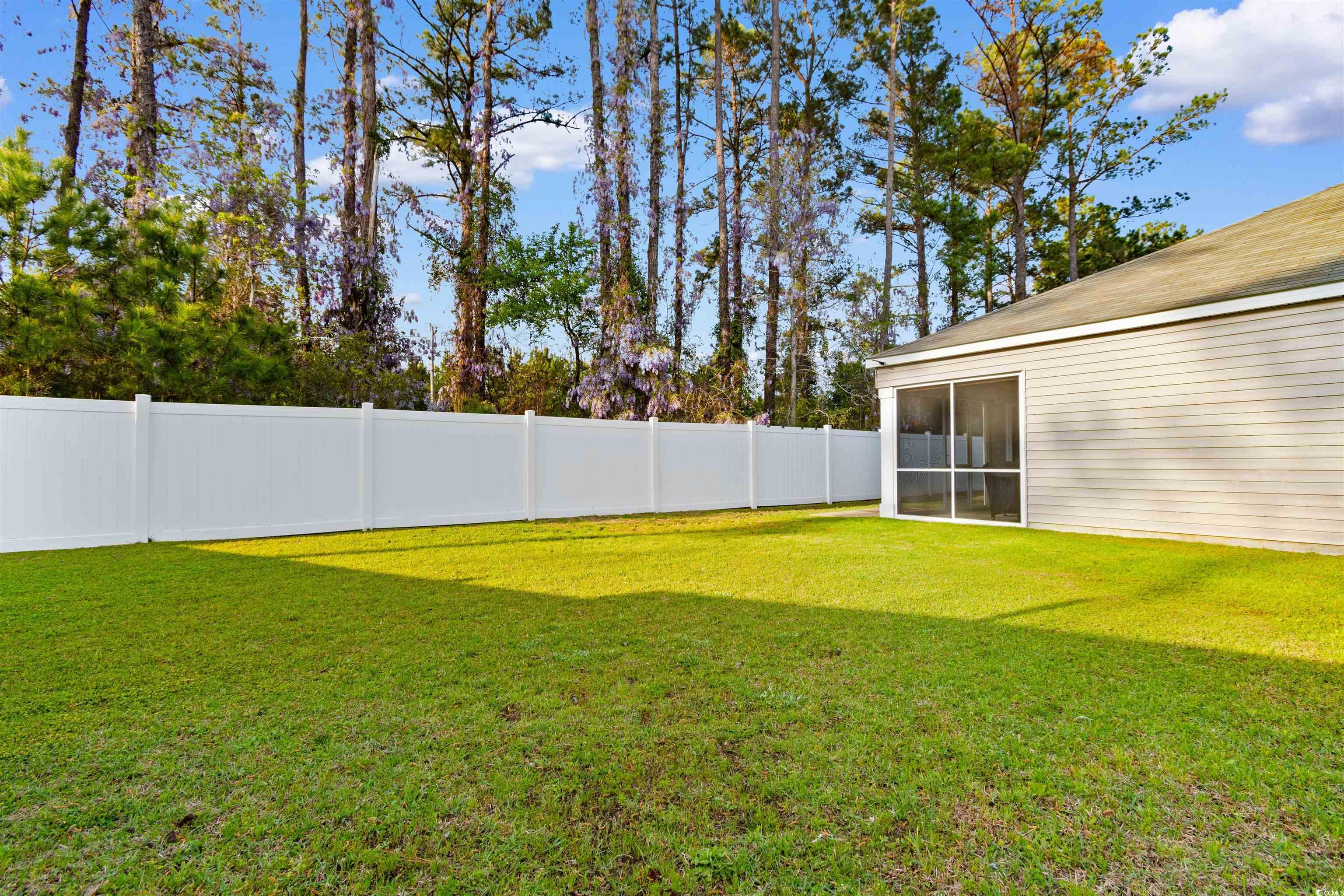 824 Twickenham Loop Longs, SC 29568 - Photo 22 of 27 View of yard featuring a fenced backyard and a sun