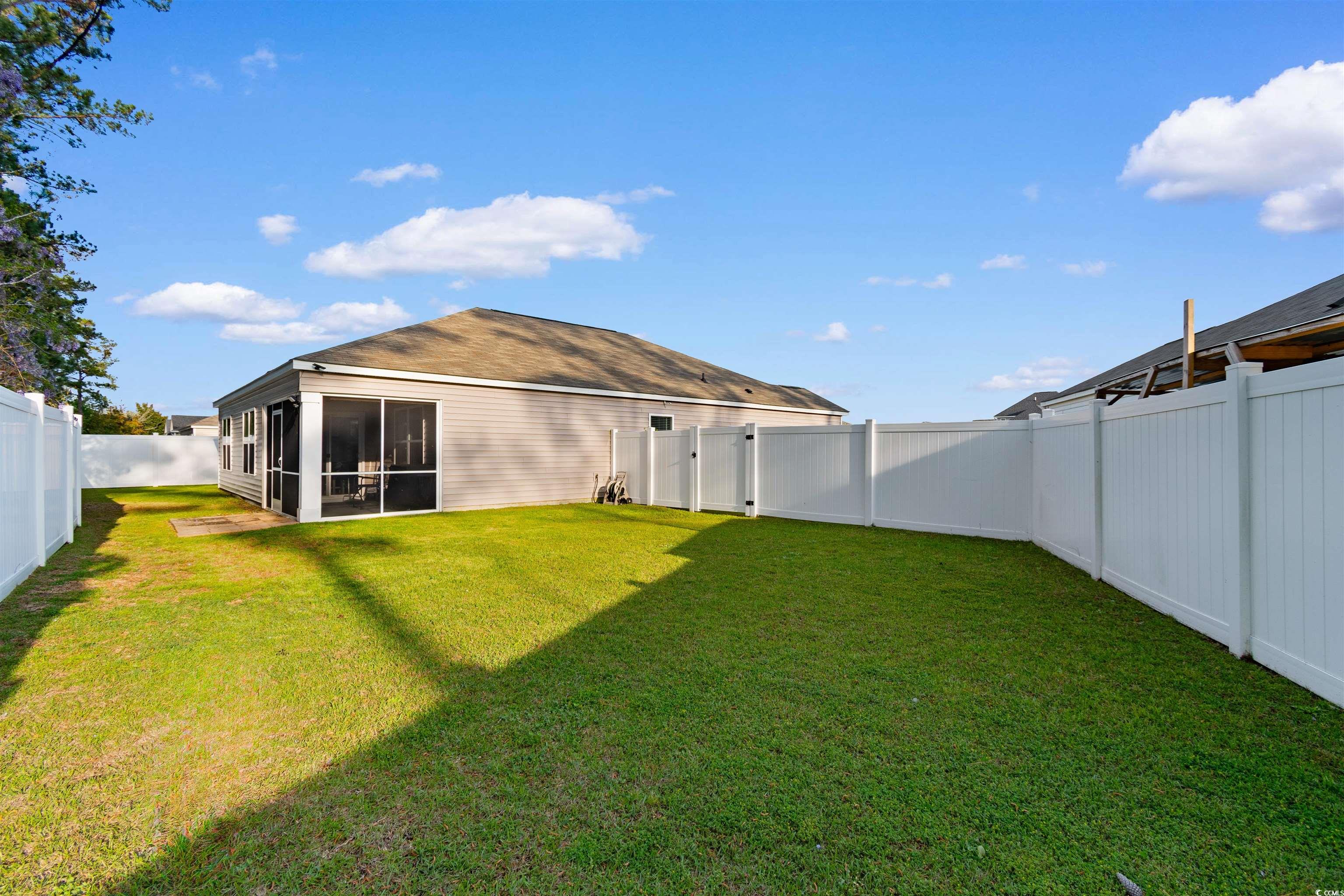 824 Twickenham Loop Longs, SC 29568 - Photo 23 of 27 View of yard featuring a fenced backyard and a sun