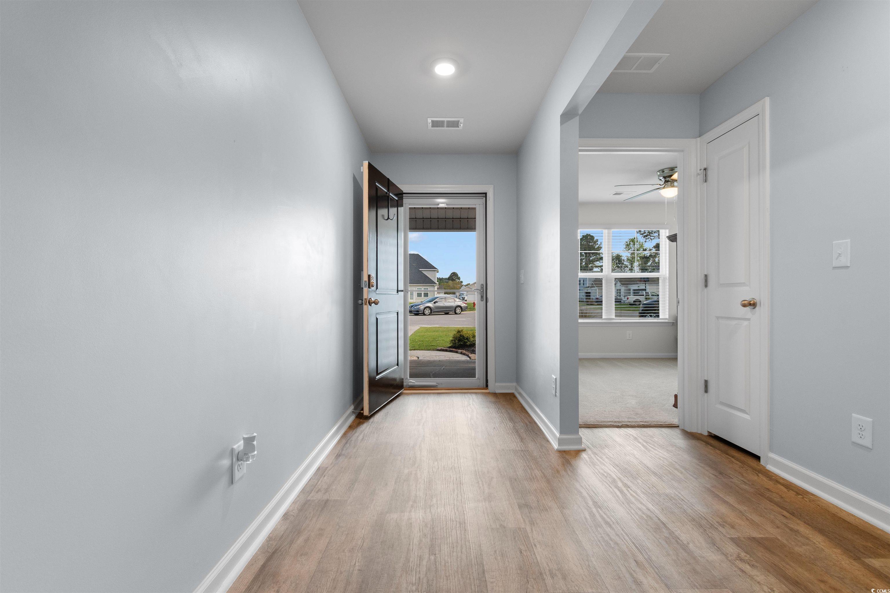 824 Twickenham Loop Longs, SC 29568 - Photo 3 of 27 Hall featuring baseboards, visible vents, and wood