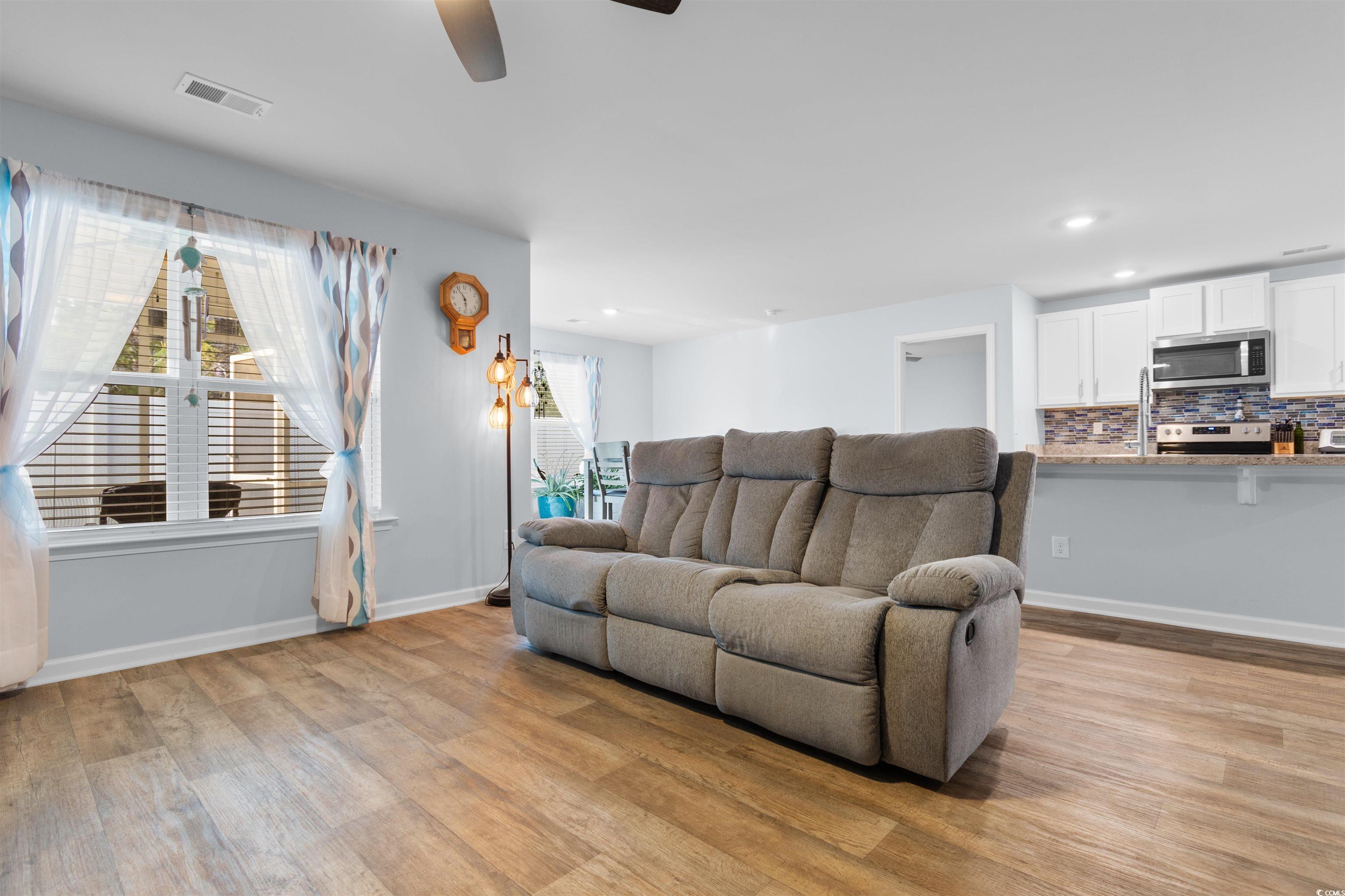 824 Twickenham Loop Longs, SC 29568 - Photo 5 of 27 Living area featuring baseboards, visible vents, l