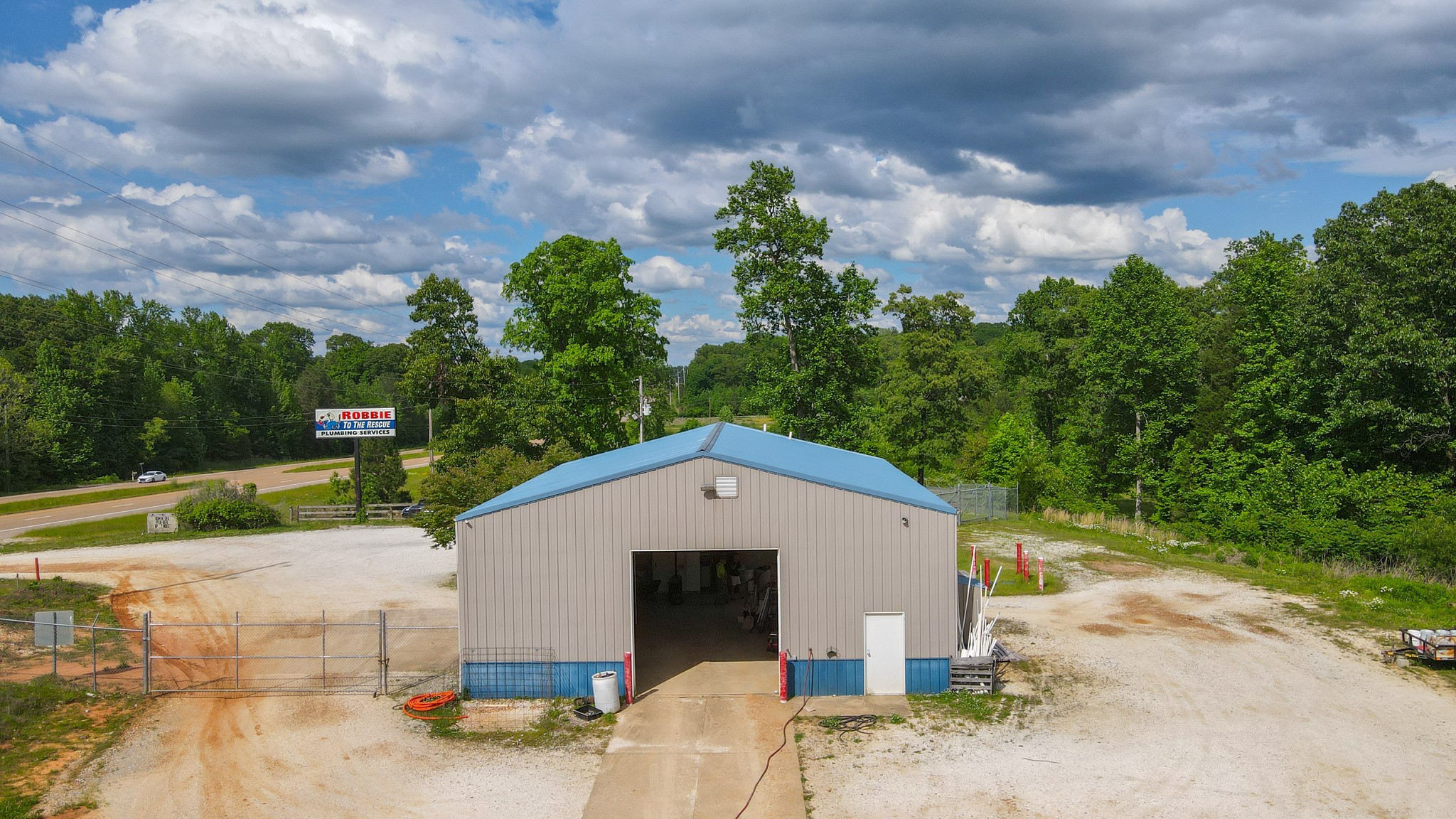10610 Highway 79 Springville, TN 38256 - Photo 11 of 60 a aerial view of a house with a yard and large tree