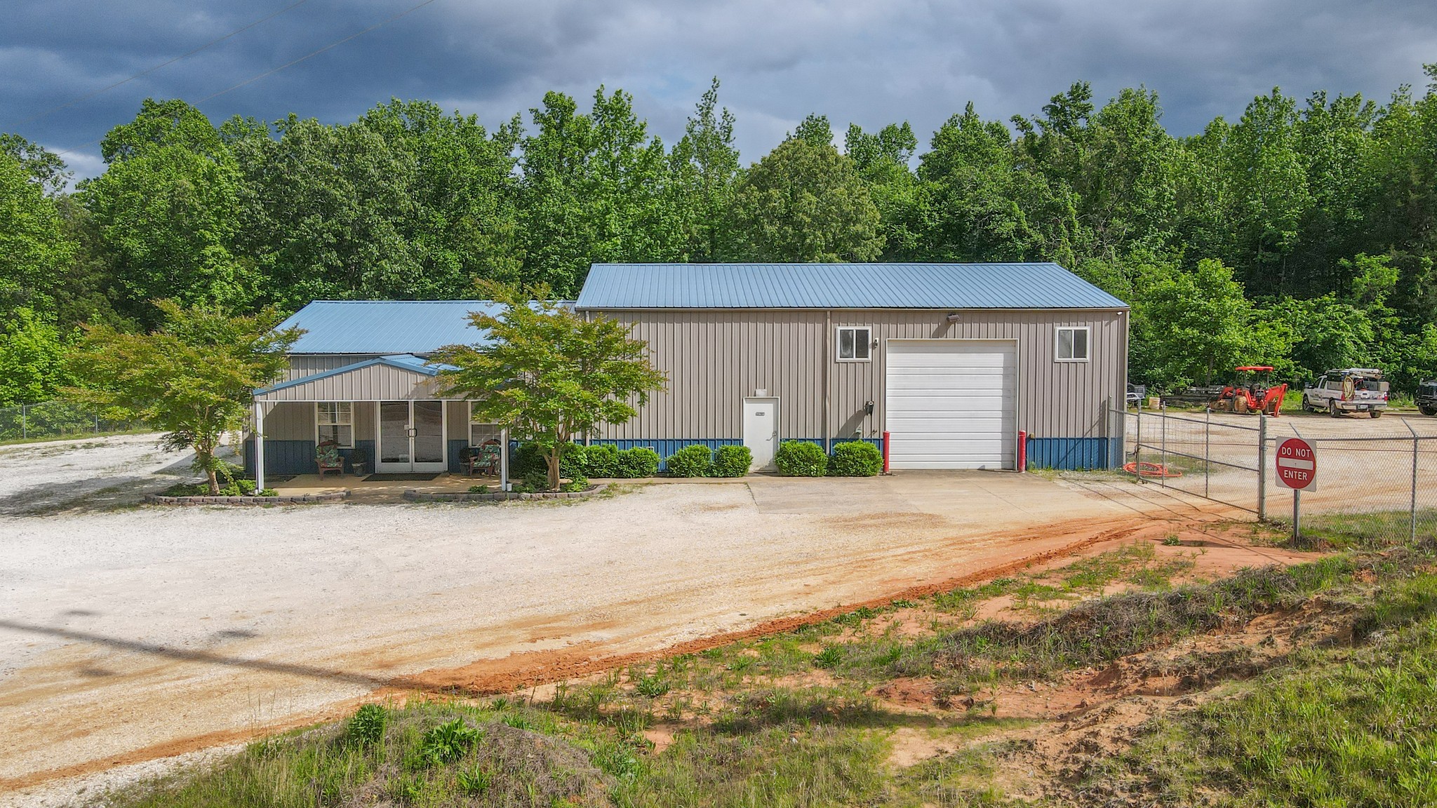 10610 Highway 79 Springville, TN 38256 - Photo 3 of 60 a front view of a house with a yard and garage