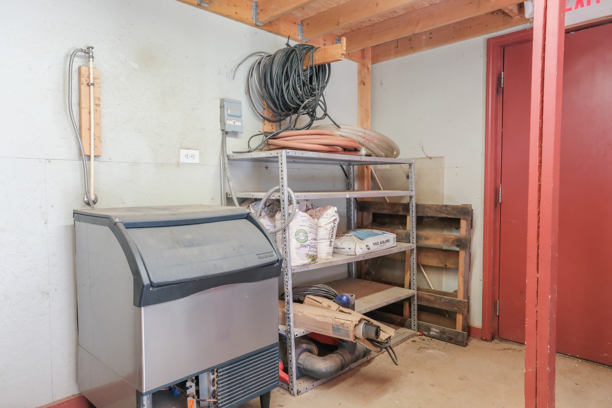 10610 Highway 79 Springville, TN 38256 - Photo 41 of 60 a view of storage and utility room with racks on the wall