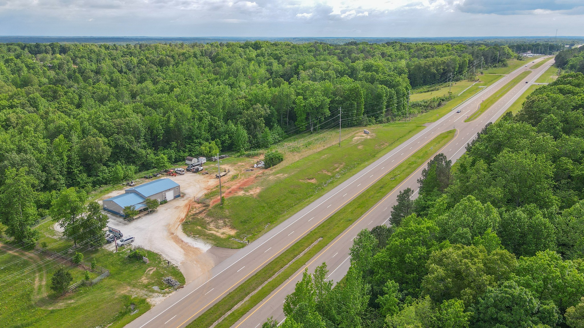 10610 Highway 79 Springville, TN 38256 - Photo 5 of 60 a view of a yard with a garden and trees