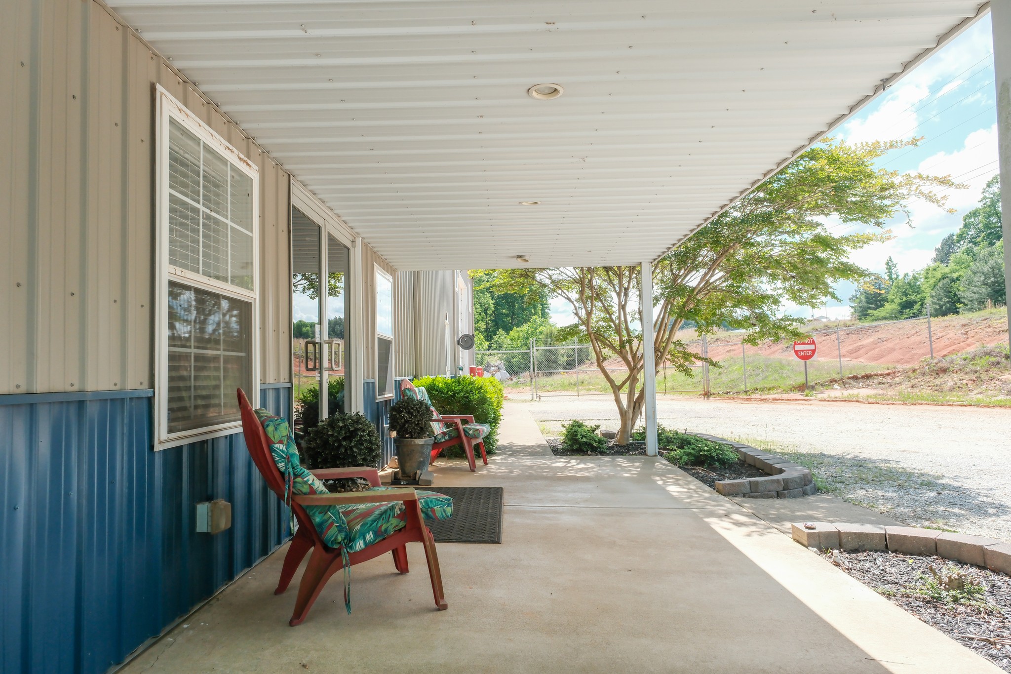 10610 Highway 79 Springville, TN 38256 - Photo 56 of 60 a view of a patio with table and chairs and potted plants