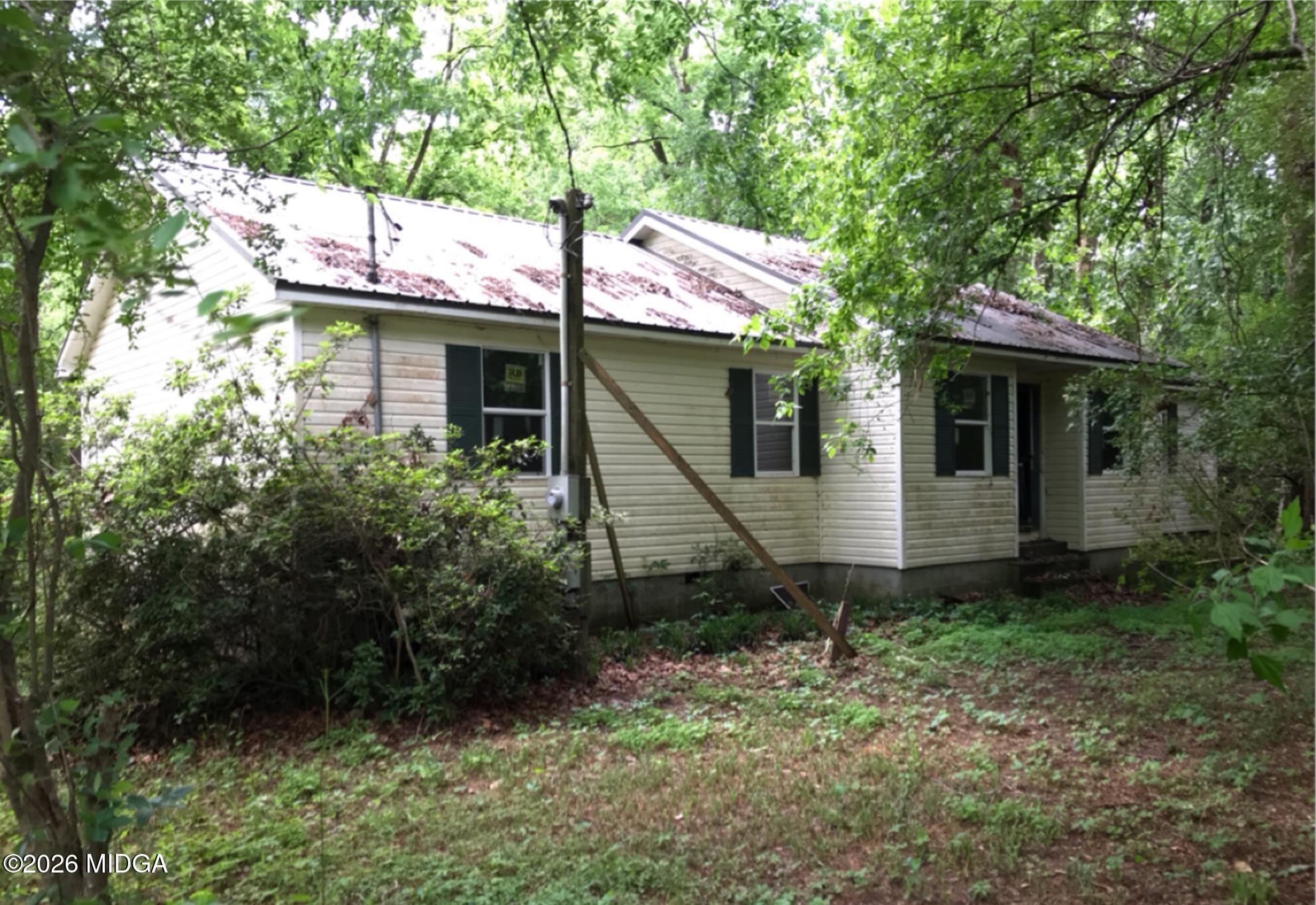 a backyard of a house with lots of green space